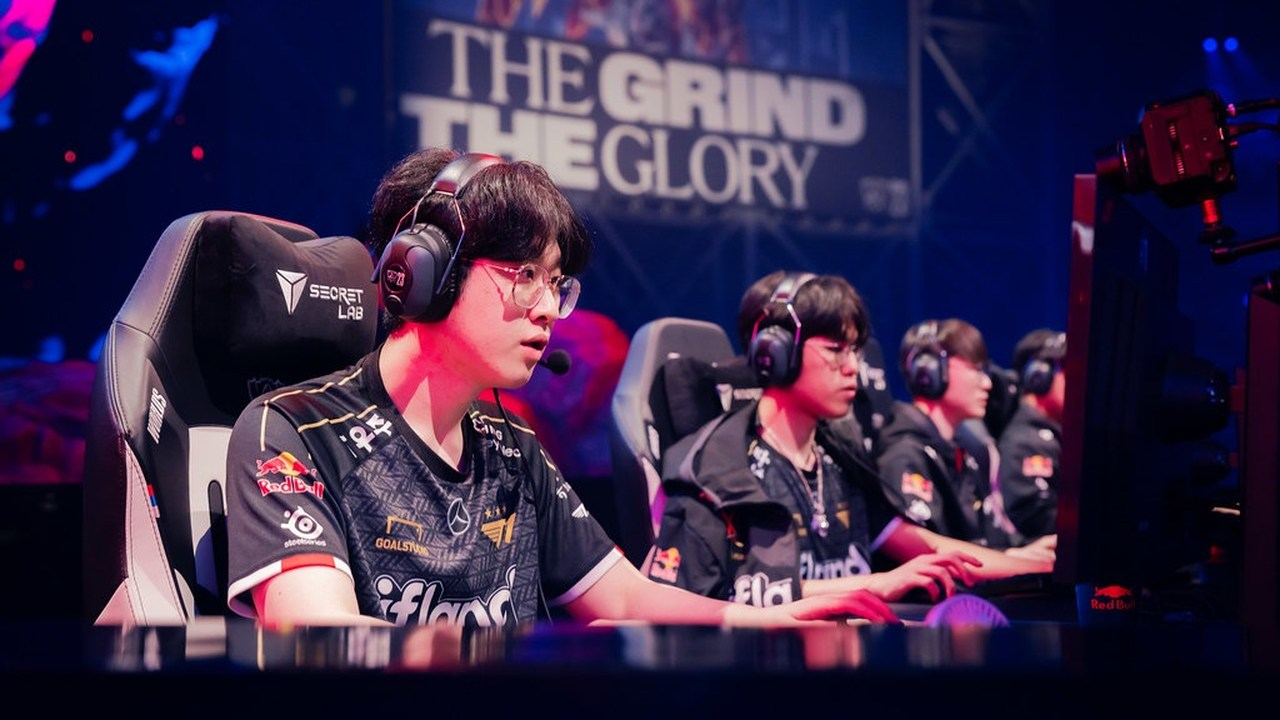 Invictus Gaming players compete at tournament computers