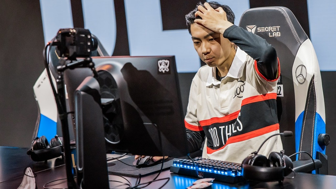 A 100 Thieves player competes at a League of Legends tournament computer