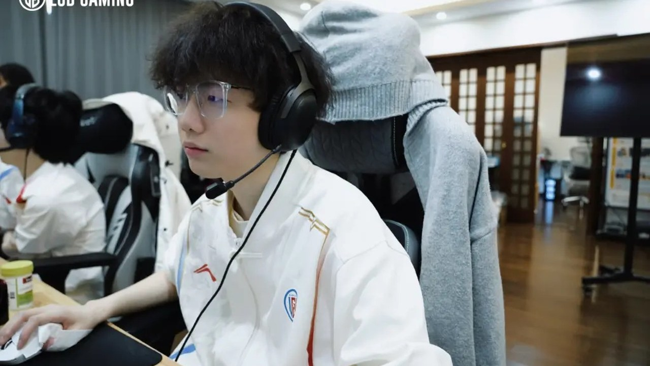 An LGD Gaming player sits at a League of Legends computer