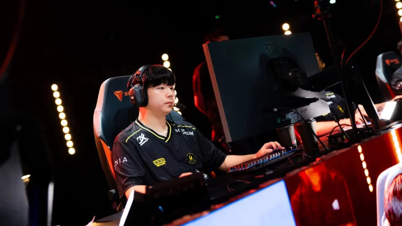 FIESTA competes at a League of Legends computer in a Team Vitality jersey