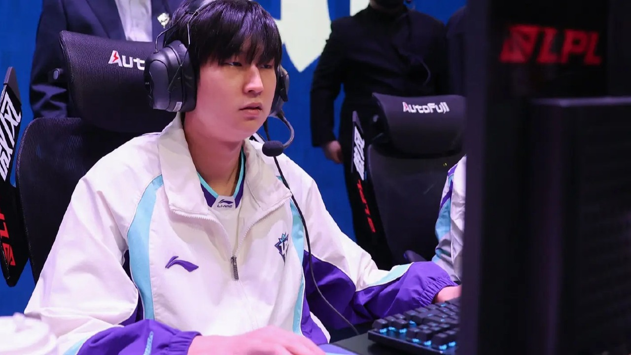 An EDward Gaming player poses in the current team jersey